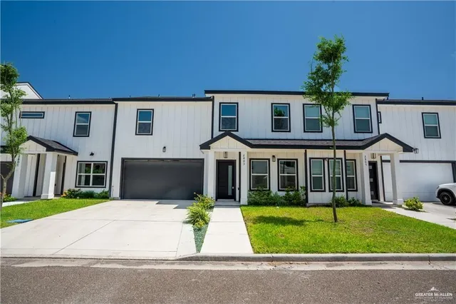 front view of a house with a garden