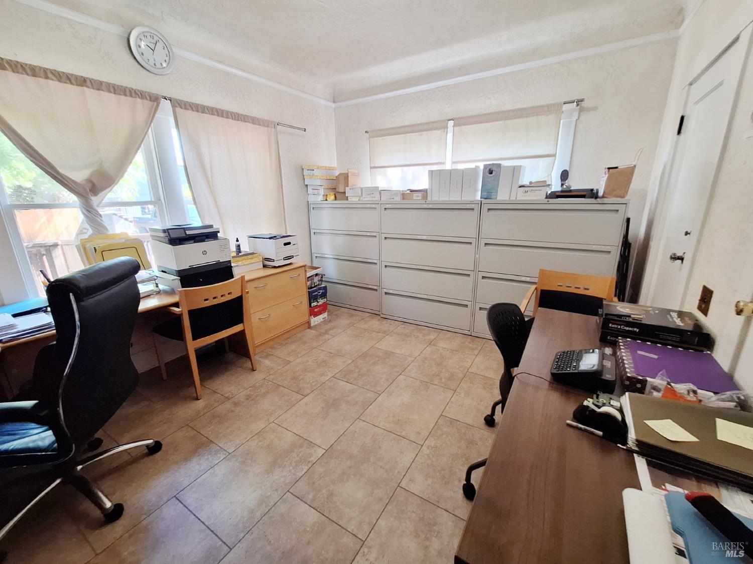 705 College Avenue Santa Rosa, CA 95404 - Photo 11 of 18 a room with a chair and windows