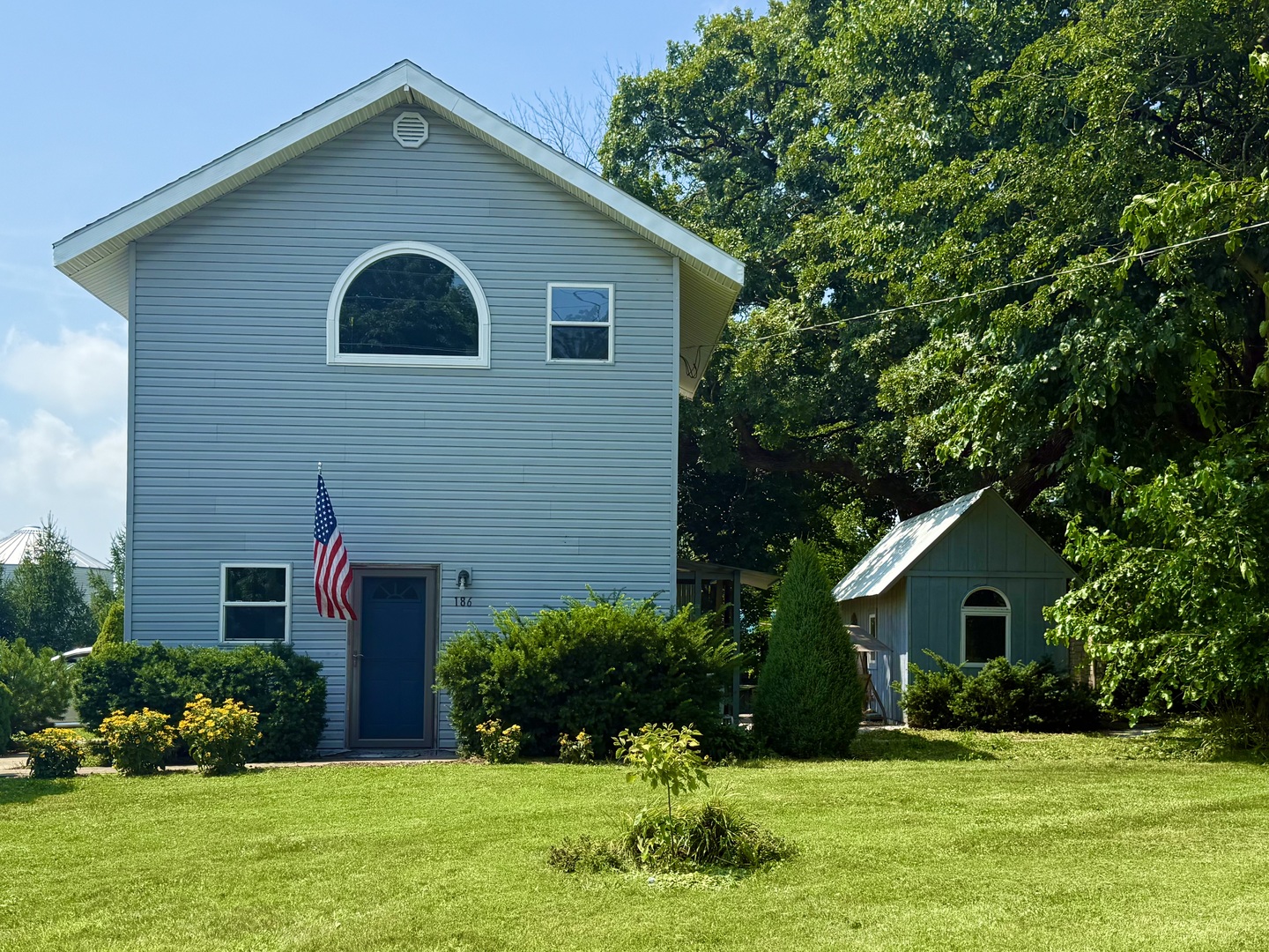 186 Peru Street Paw Paw, IL 61353 - Photo 1 of 27 a front view of house with yard and green space