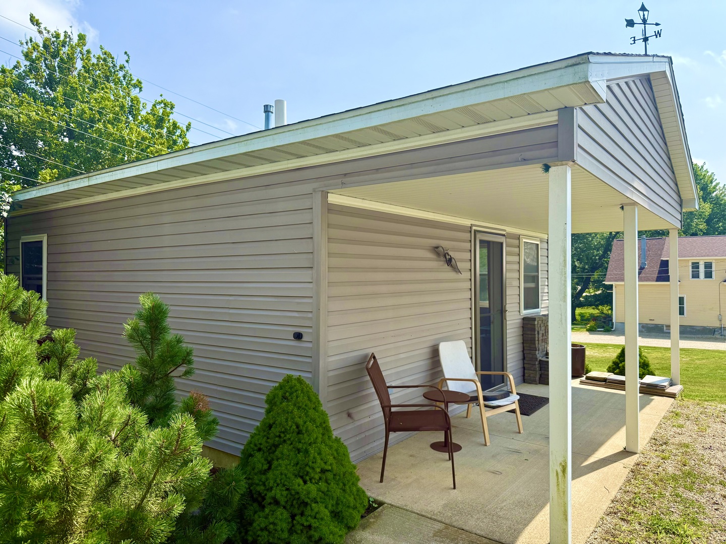 186 Peru Street Paw Paw, IL 61353 - Photo 27 of 27 a view of a patio with table and chairs and potted plants