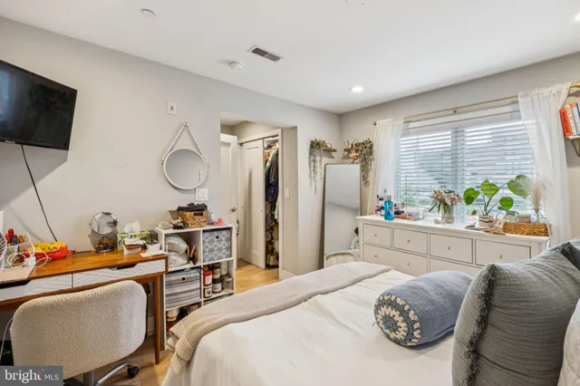 a bathroom with a toilet a sink and a mirror