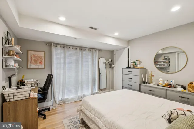 a bed room with a bed and a book shelf