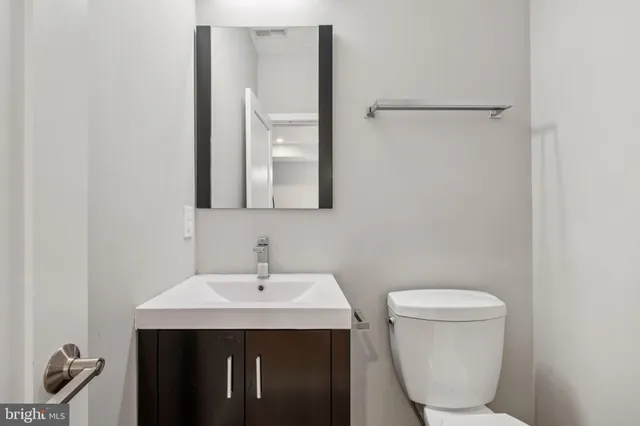 a kitchen with stainless steel appliances a sink stove and refrigerator