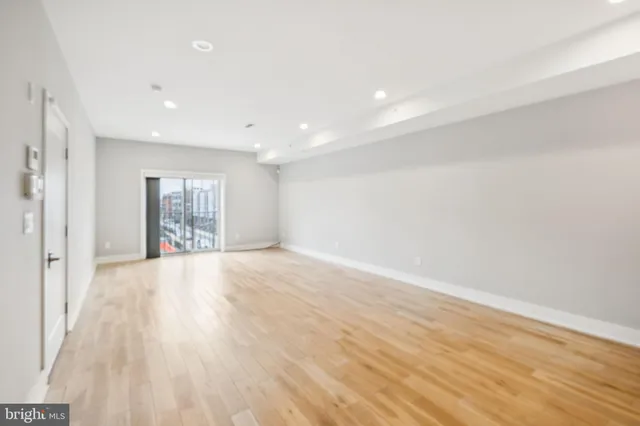 a bathroom with a sink a mirror a toilet and shower