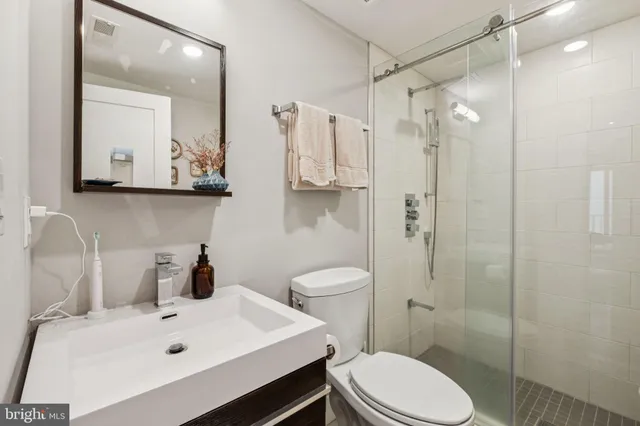 a bedroom with a bed and a table in it