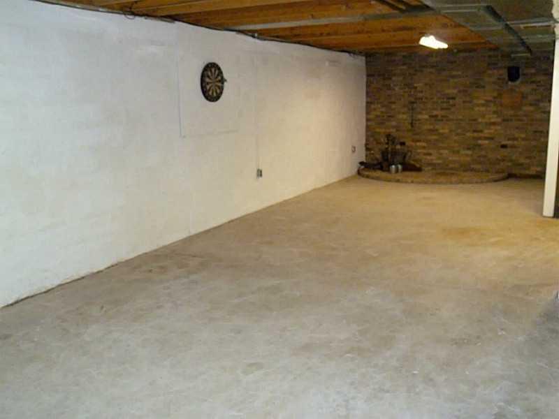 394 Maple Road Burgettstown, PA 15021 - Photo 15 of 25 Basement/Game Room. LL game room waiting to be finished into a theater room or entertainment area. Brick wall and hearth for potential woodburning stove.