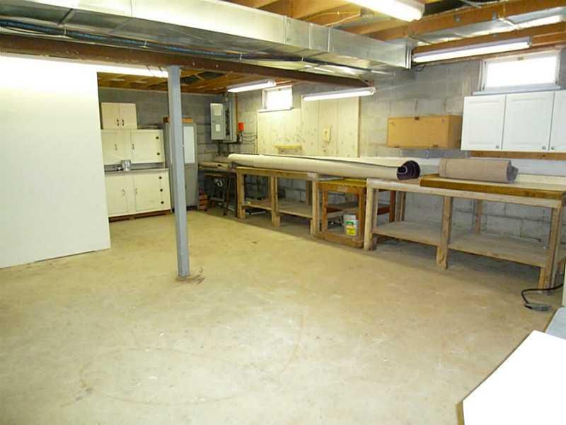 394 Maple Road Burgettstown, PA 15021 - Photo 16 of 25 Basement/Game Room. Work shop w/ built in cabinets and work benches.