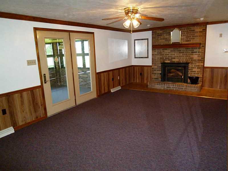 394 Maple Road Burgettstown, PA 15021 - Photo 7 of 25 Family Room. The family room is not only open to the kitchen but also to the 3 season/sun-room for added entertaining.
