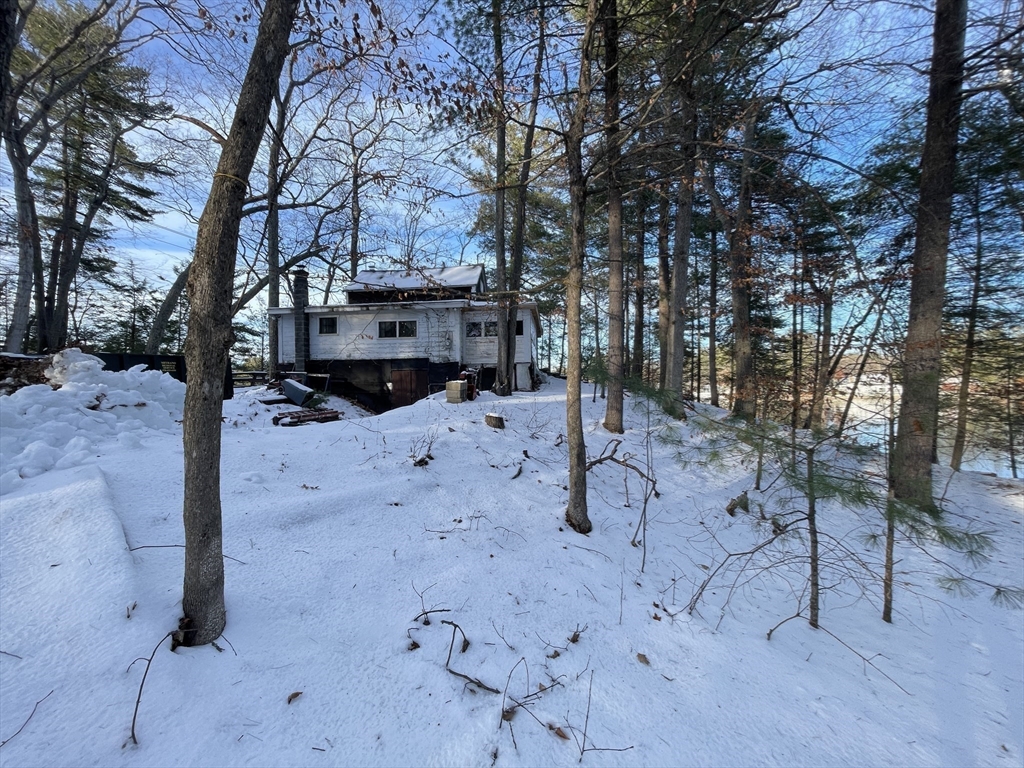 172 Shelters Road Groton, MA 01450 - Photo 11 of 40 a view of a covered with snow in the yard