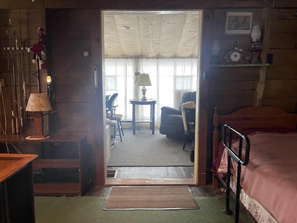172 Shelters Road Groton, MA 01450 - Photo 19 of 40 a living room with furniture and a window