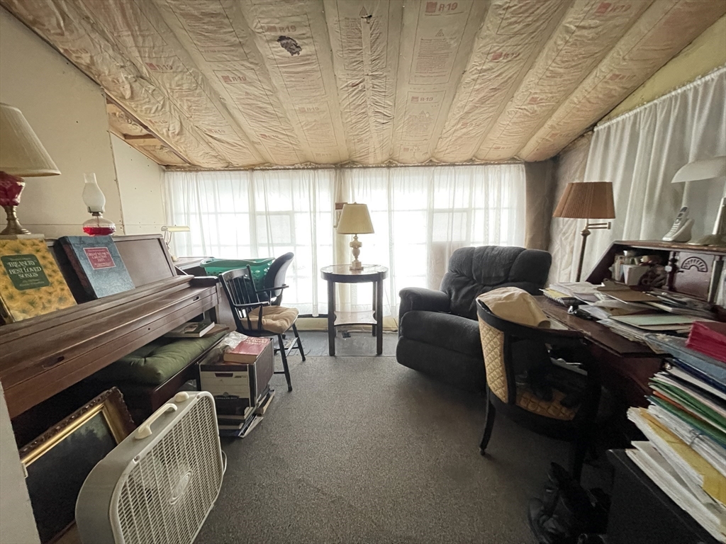 172 Shelters Road Groton, MA 01450 - Photo 20 of 40 a living room with furniture and a window