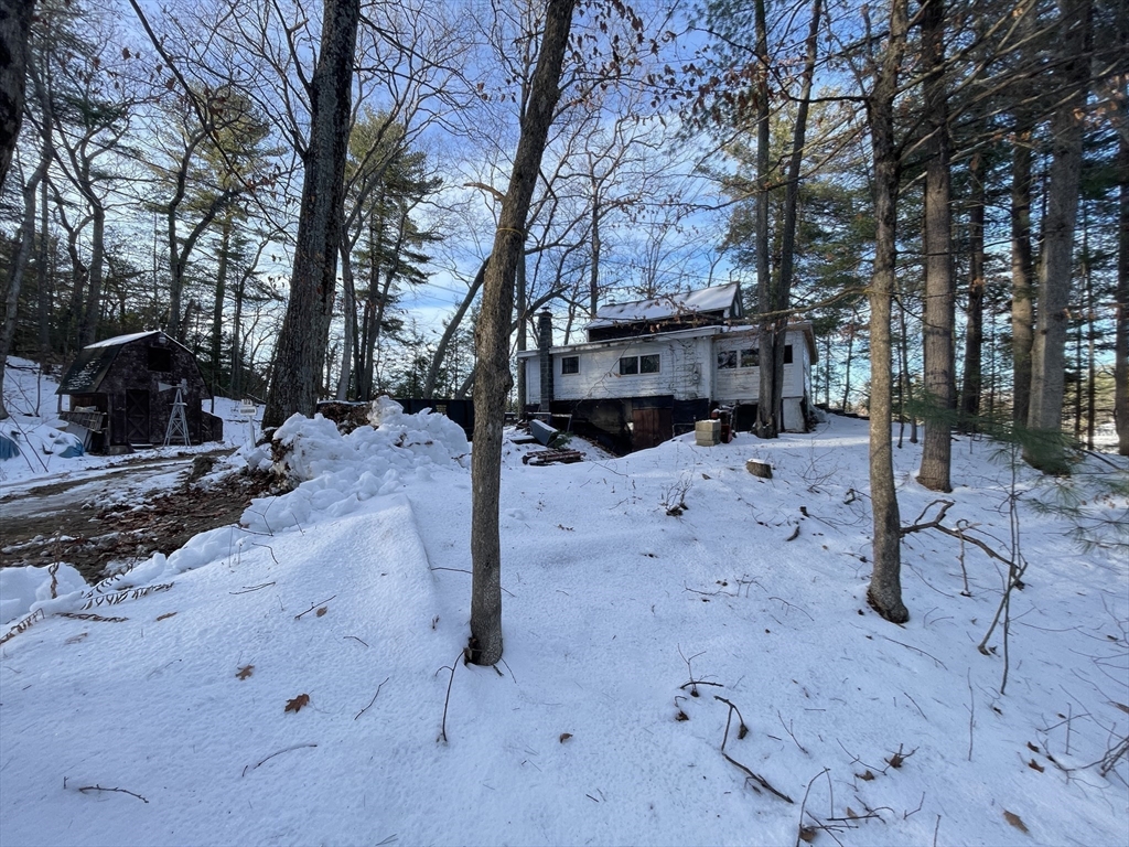 172 Shelters Road Groton, MA 01450 - Photo 2 of 40 a street view covered with snow