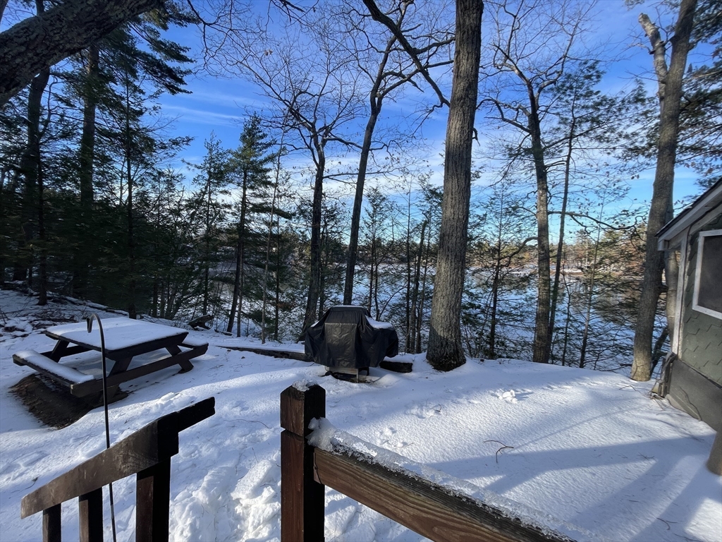 172 Shelters Road Groton, MA 01450 - Photo 9 of 40 a view of a couches and table in the patio