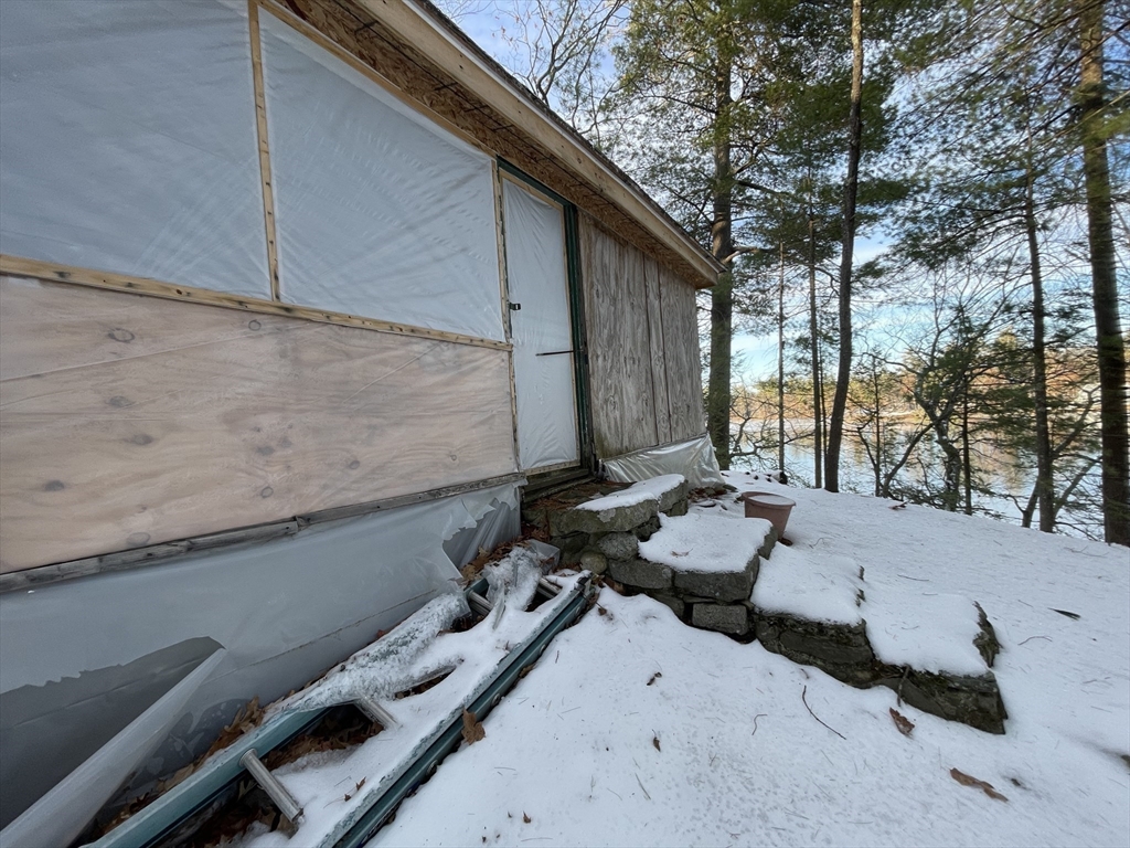 172 Shelters Road Groton, MA 01450 - Photo 10 of 40 a backyard of a house with chairs and tree
