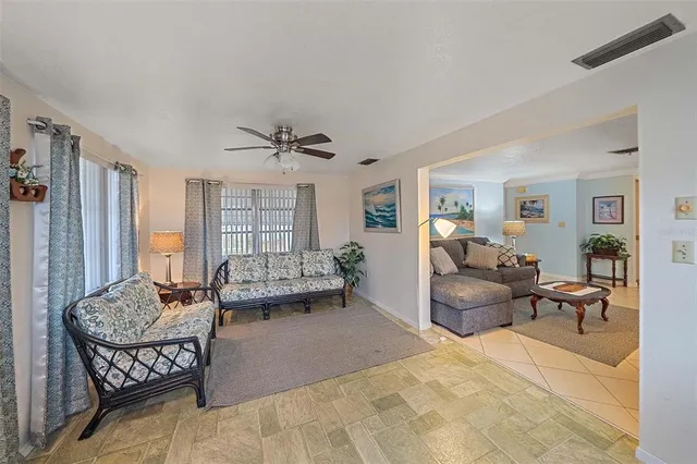 a kitchen with cabinets appliances a sink and a window