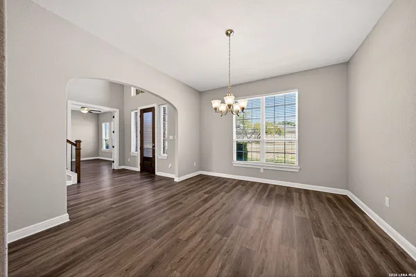 a view of empty room with ceiling fan