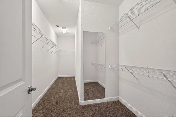 a front view of a house with swimming pool having outdoor seating