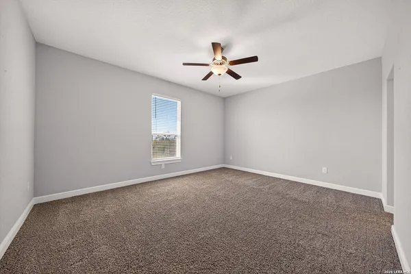 a view of a house with swimming pool in front of it