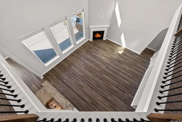 a view of a kitchen with white cabinets