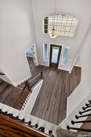 an aerial view of a house with swimming pool and ocean view