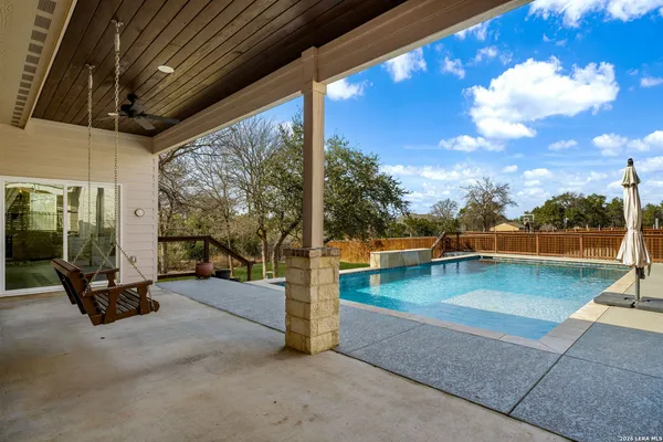 a kitchen with stainless steel appliances granite countertop a refrigerator a stove and a sink