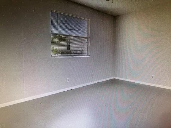 2203 Tabor Court Austin, TX 78748 - Photo 2 of 6 a view of an empty room and window