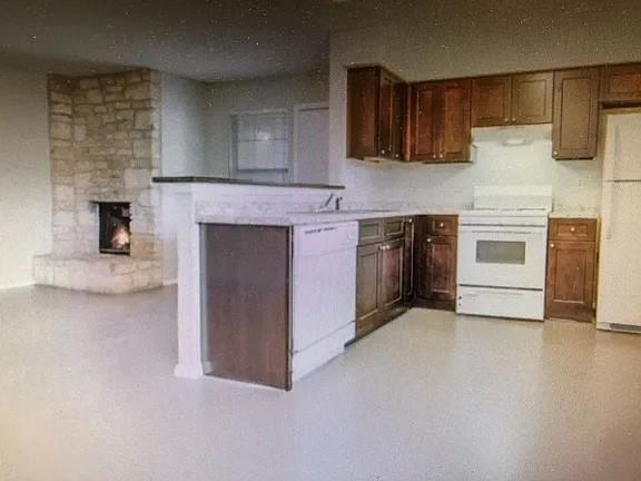 2203 Tabor Court Austin, TX 78748 - Photo 5 of 6 a kitchen with a stove and a refrigerator