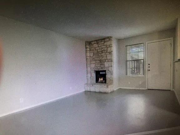 2203 Tabor Court Austin, TX 78748 - Photo 6 of 6 an empty room with a fireplace and wooden floor