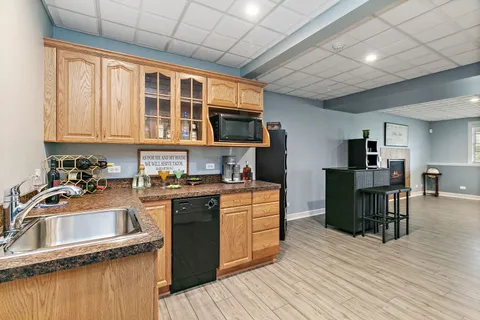 a kitchen with stainless steel appliances granite countertop a stove and a sink