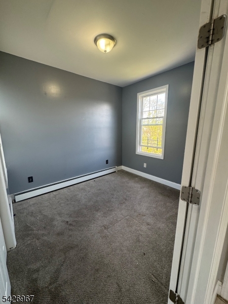 23 Elliott Street Newark, NJ 07104 - Photo 13 of 25 a view of an empty room and a window