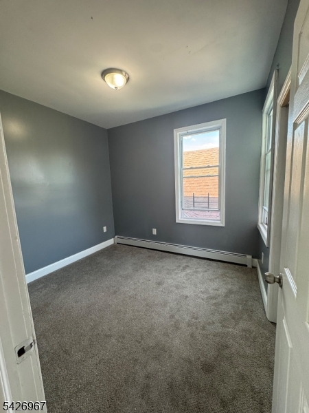 23 Elliott Street Newark, NJ 07104 - Photo 15 of 25 an empty room with windows