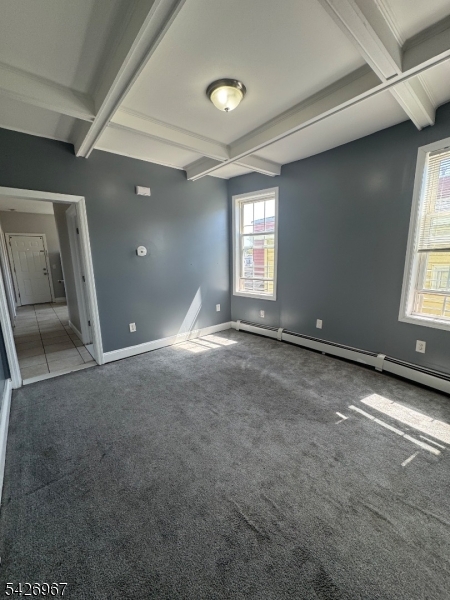 23 Elliott Street Newark, NJ 07104 - Photo 6 of 25 an empty room with windows