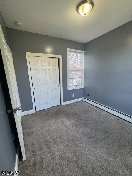 23 Elliott Street Newark, NJ 07104 - Photo 10 of 25 an empty room with windows