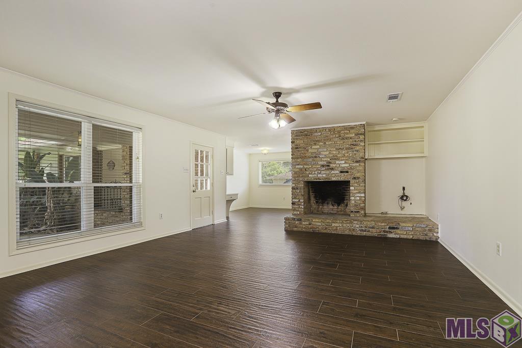 5621 Hyacinth Avenue Baton Rouge, LA 70808 - Photo 9 of 39 Den fireplace