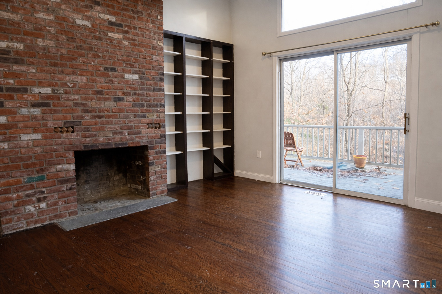 2079 Portland-Cobalt Road Portland, CT 06480 - Photo 11 of 13 a view of a livingroom with wooden floor and a fireplace