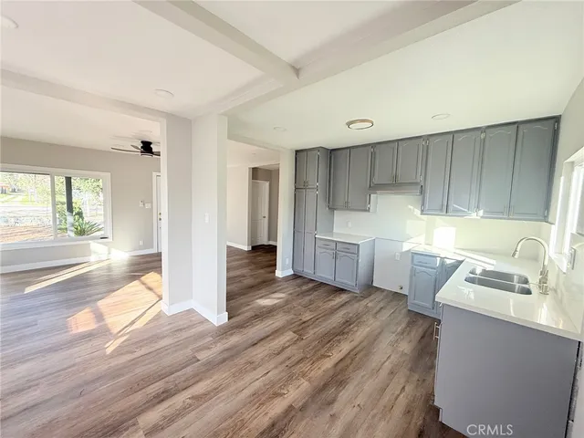 a kitchen with a refrigerator and a sink
