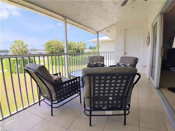 a view of balcony with furniture