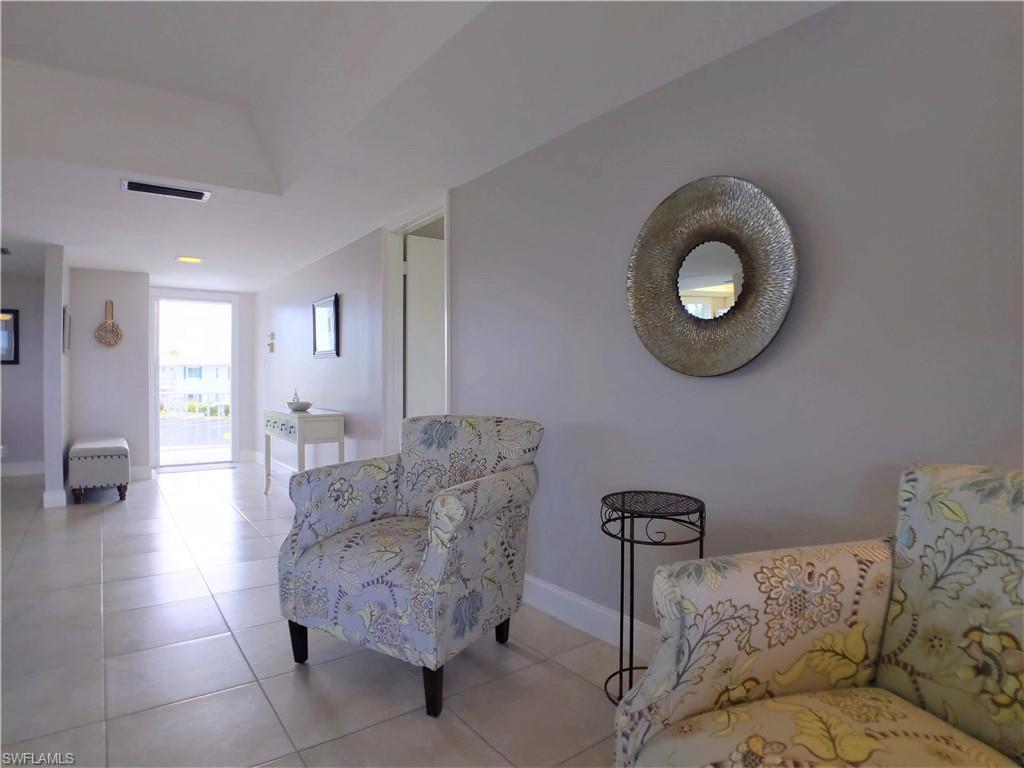 108 Penny Lane, Unit 4 Naples, FL 34112 - Photo 5 of 33 a living room with furniture and a couch