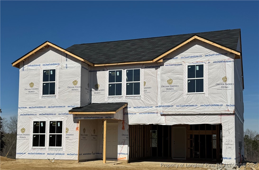 a front view of a house with a garage