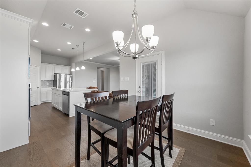 1904 Angelus Street Waco, TX 76712 - Photo 11 of 24 Dining room with dark wood-style floors, recessed lighting, a chandelier, and lofted ceiling