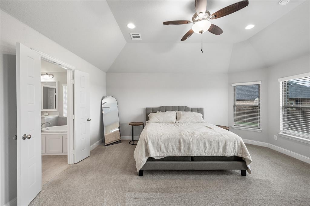1904 Angelus Street Waco, TX 76712 - Photo 12 of 24 Bedroom featuring lofted ceiling, light carpet, ensuite bath, a ceiling fan, and recessed lighting