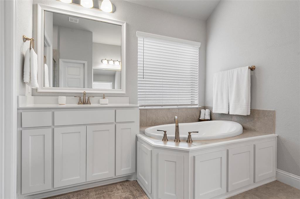 1904 Angelus Street Waco, TX 76712 - Photo 15 of 24 Bathroom with vanity and a bath