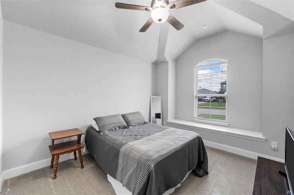 1904 Angelus Street Waco, TX 76712 - Photo 19 of 24 Carpeted bedroom featuring lofted ceiling and a ceiling fan