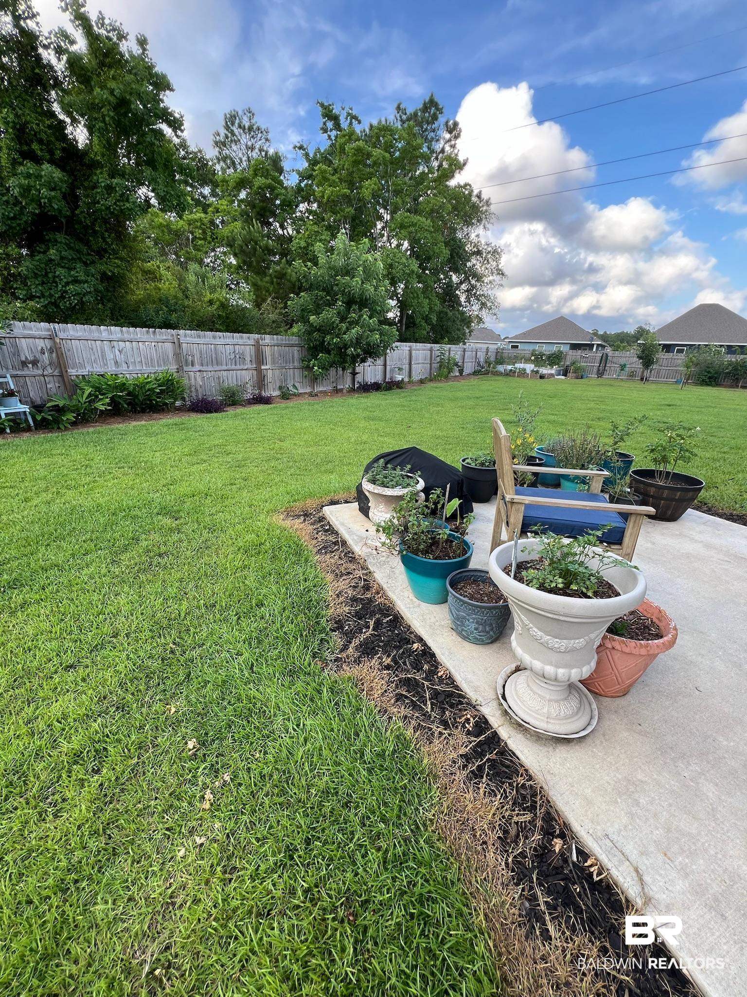 3904 Conrad Court Gulf Shores, AL 36542 - Photo 22 of 24 View of yard with a patio
