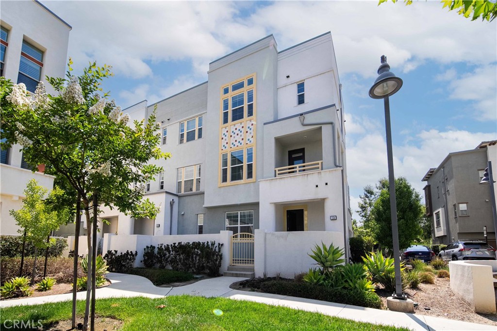 134 Acamar Irvine, CA 92618 - Photo 1 of 56 a front view of a house with a garden