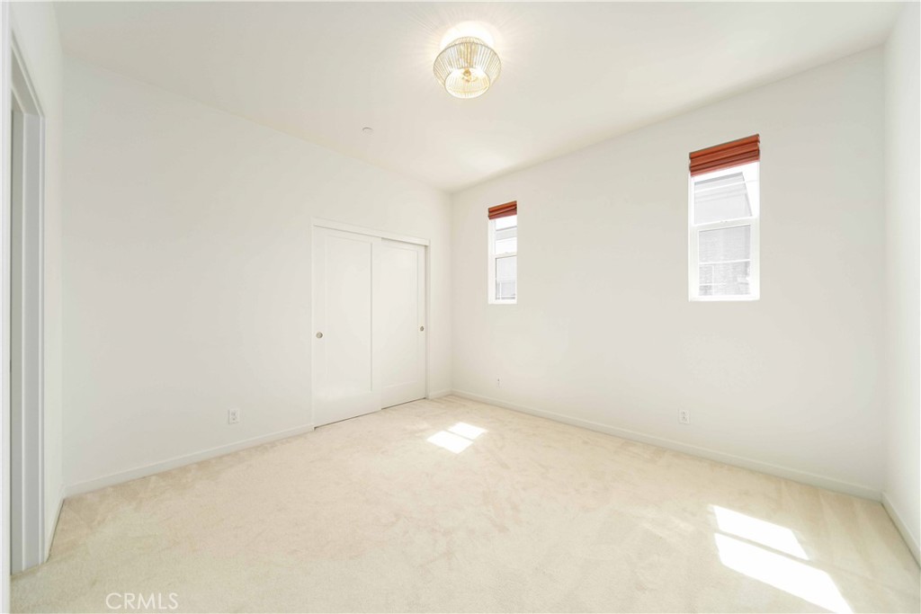 134 Acamar Irvine, CA 92618 - Photo 19 of 56 an empty room with a fan