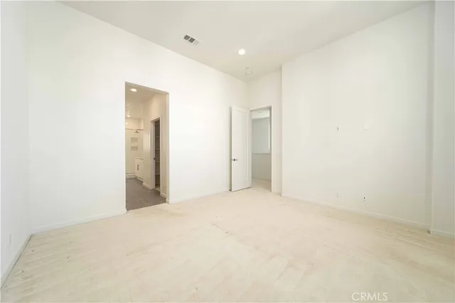 a spacious bathroom with a shower sink and mirror