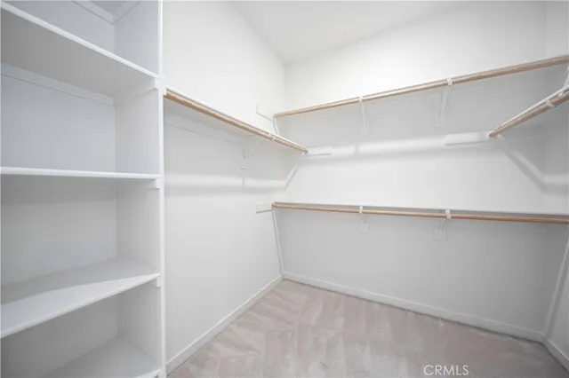 a spacious bathroom with a shower sink and mirror