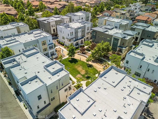 an aerial view of residential building and lake