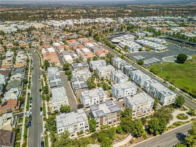 an aerial view of residential building and lake